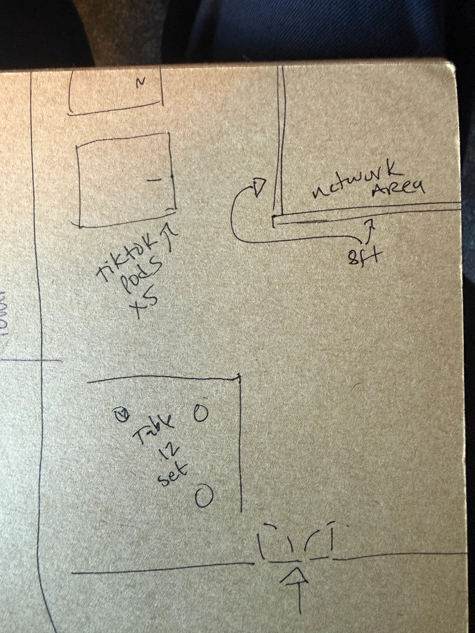 Hand-drawn studio layout notes in a notebook