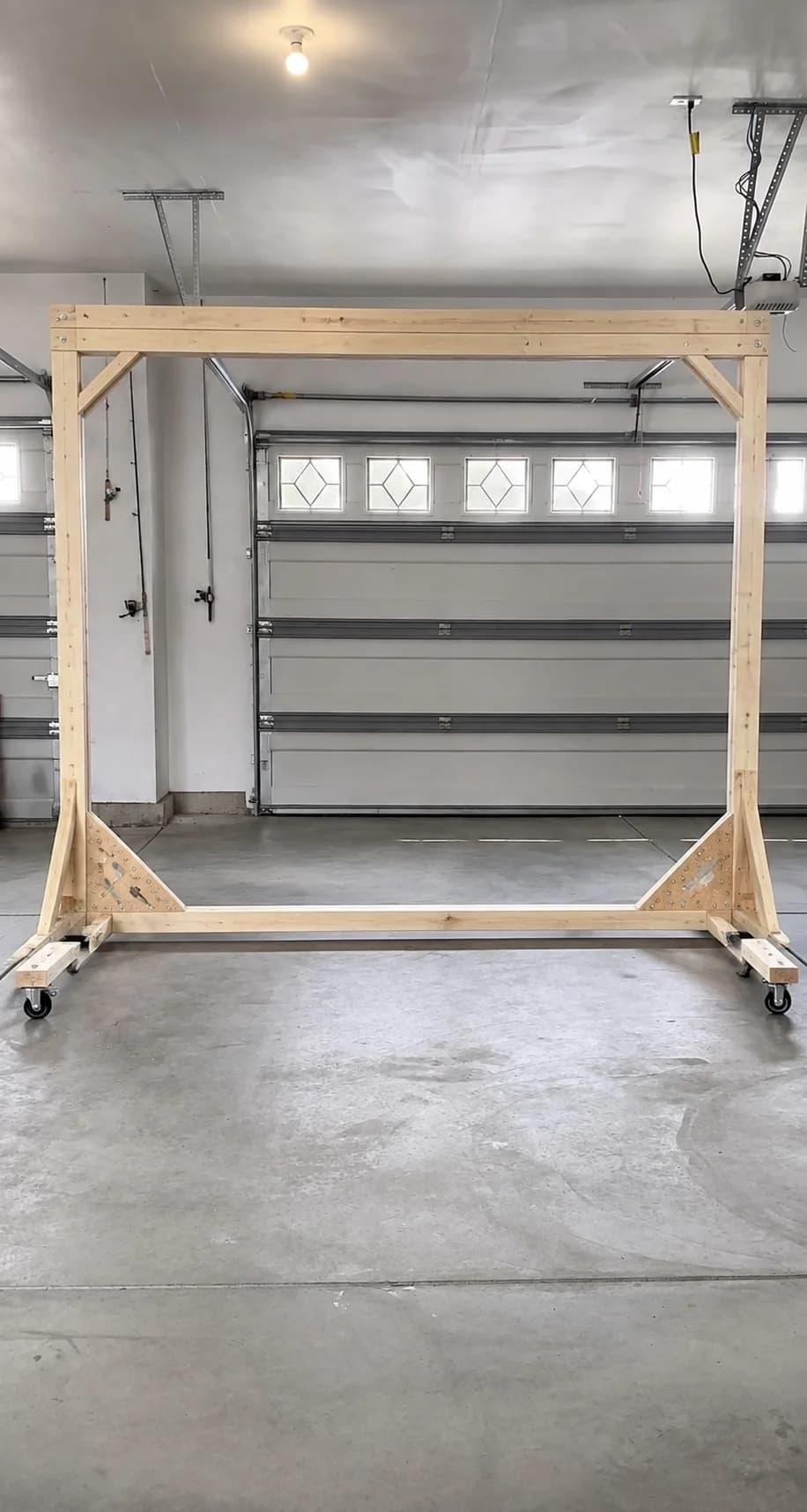 Reference image of a reinforced timber backdrop frame on castor wheels