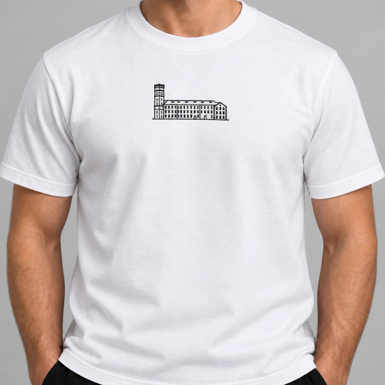 The mill identity showing the mill building embroidered on a white T-shirt