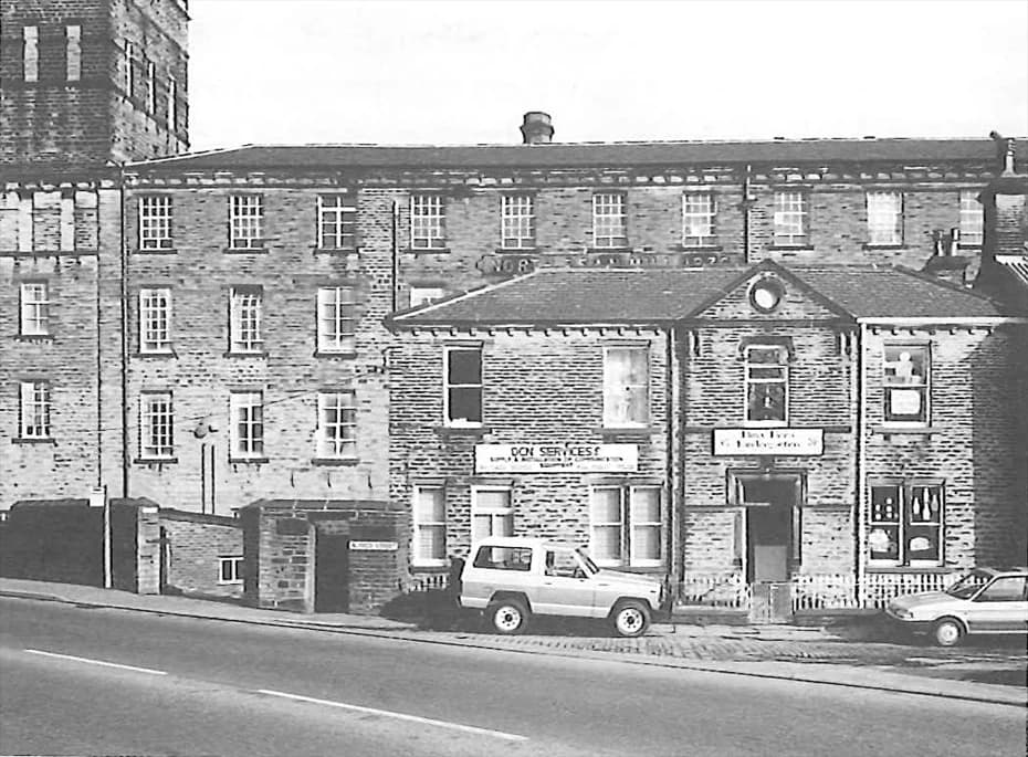 Black and white archive photograph of North Dean Mill's frontage
