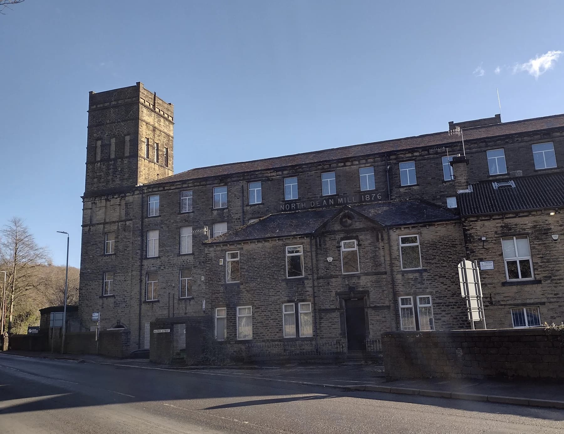 Photograph of North Dean Mill's stone frontage and tower